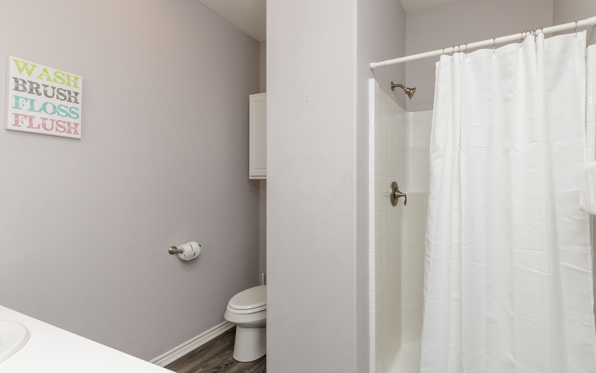 Step into your private bathroom with modern fixtures, fresh shower, and cheerful decor that makes your morning routine feel like a spa retreat.