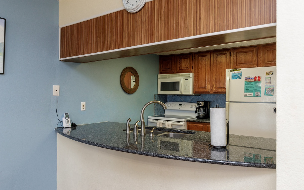 Your fully equipped kitchen features granite countertops, modern appliances, and everything you need to prepare meals during your stay.