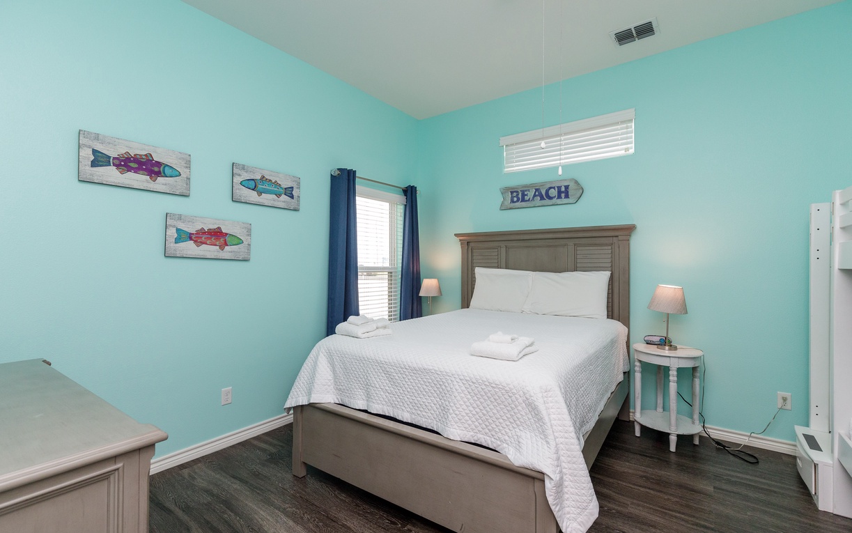 Your guest bedroom features a queen size bed, twin size bunk beds, and crisp linens for peaceful sleep.