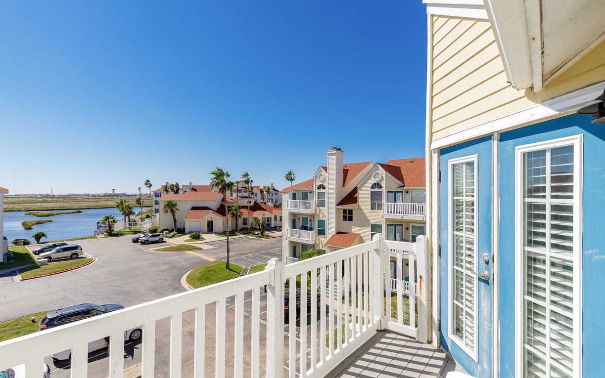 Step onto your private balcony and soak in sweeping views of the waterfront community and sparkling bay beyond.