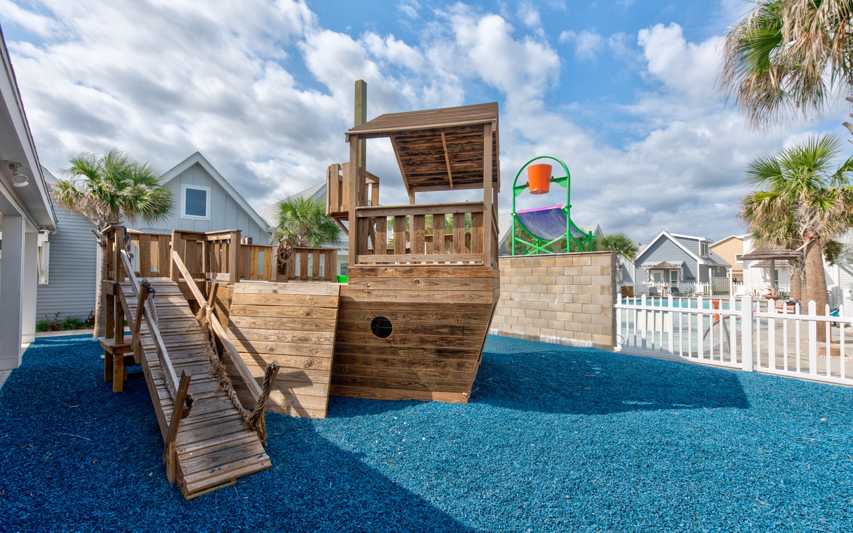 A fantastic pirate ship playground awaits your little adventurers, complete with climbing features and soft blue surfacing for safe fun.