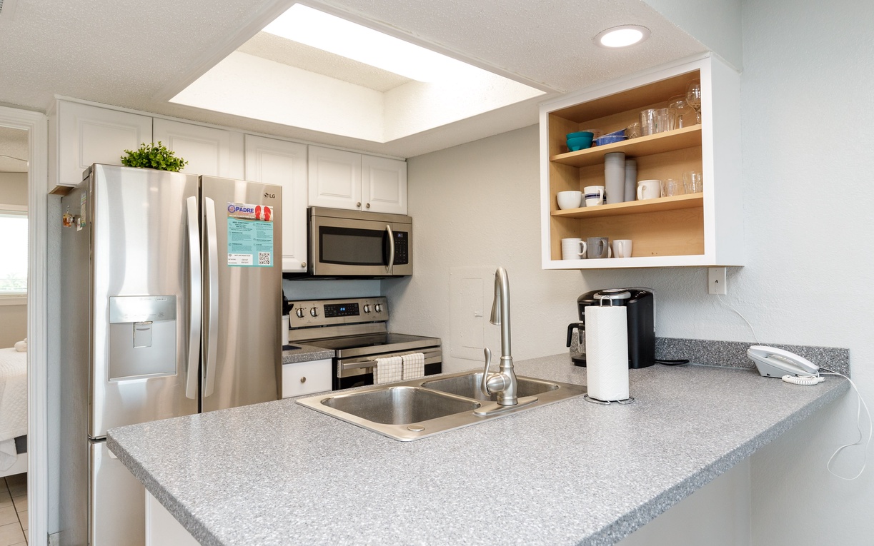 Your fully-equipped kitchen awaits with modern appliances and granite countertops, perfect for preparing home-cooked meals during your stay.