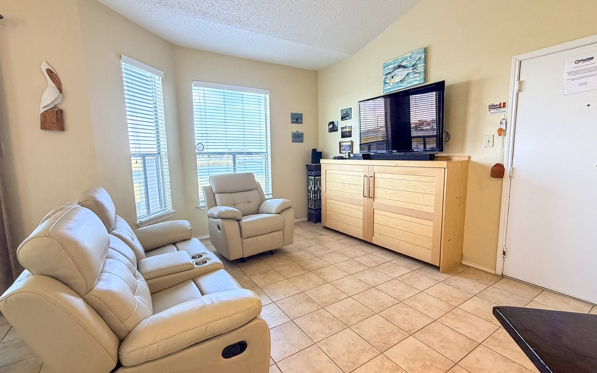 Unwind in your comfortable living space with plush reclining seating and entertainment center, perfect for relaxing after exploring.