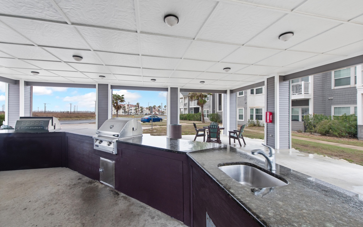 Cook your favorite meals in this sleek outdoor kitchen while enjoying views of the nearby waterfront area.