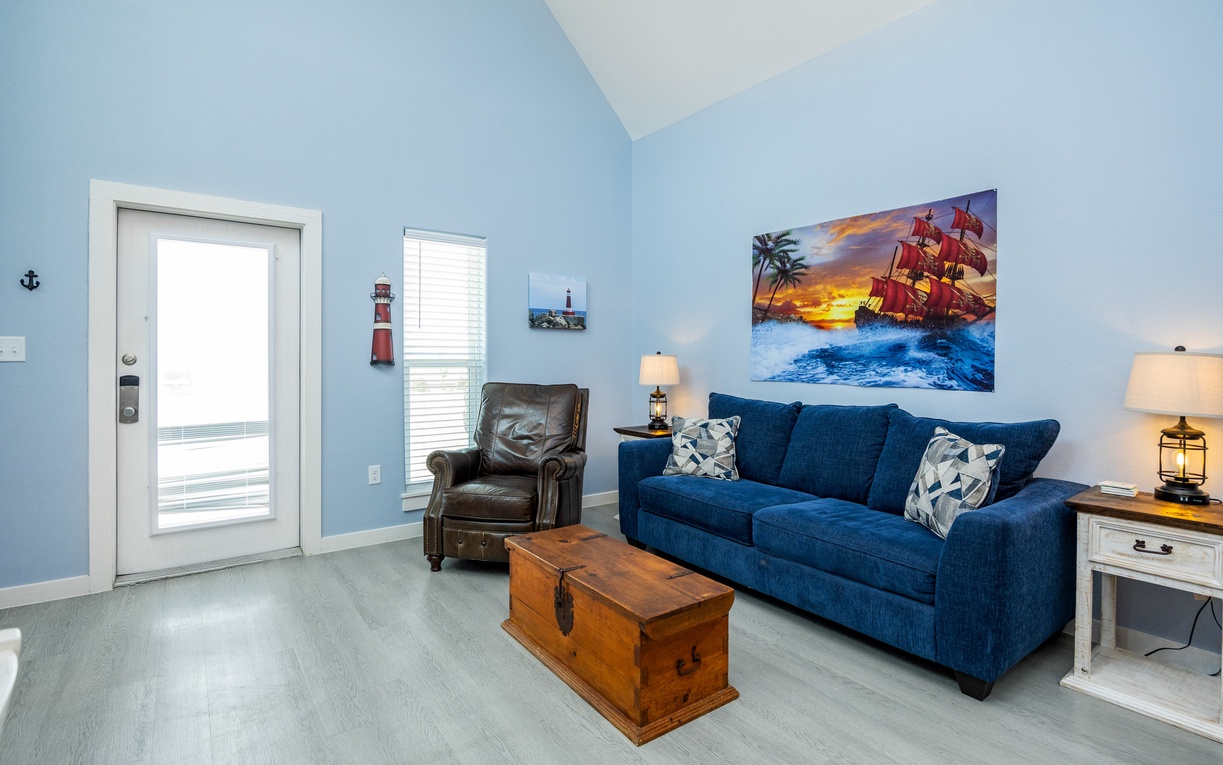 Sink into your cozy nautical retreat with plush seating and maritime artwork that sets the perfect coastal mood for your getaway.