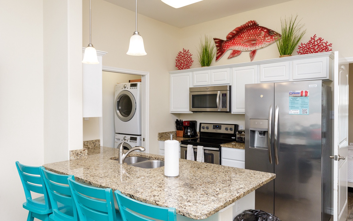 Your fully-equipped kitchen invites culinary adventures with granite counters, stainless appliances, and convenient in-unit laundry.