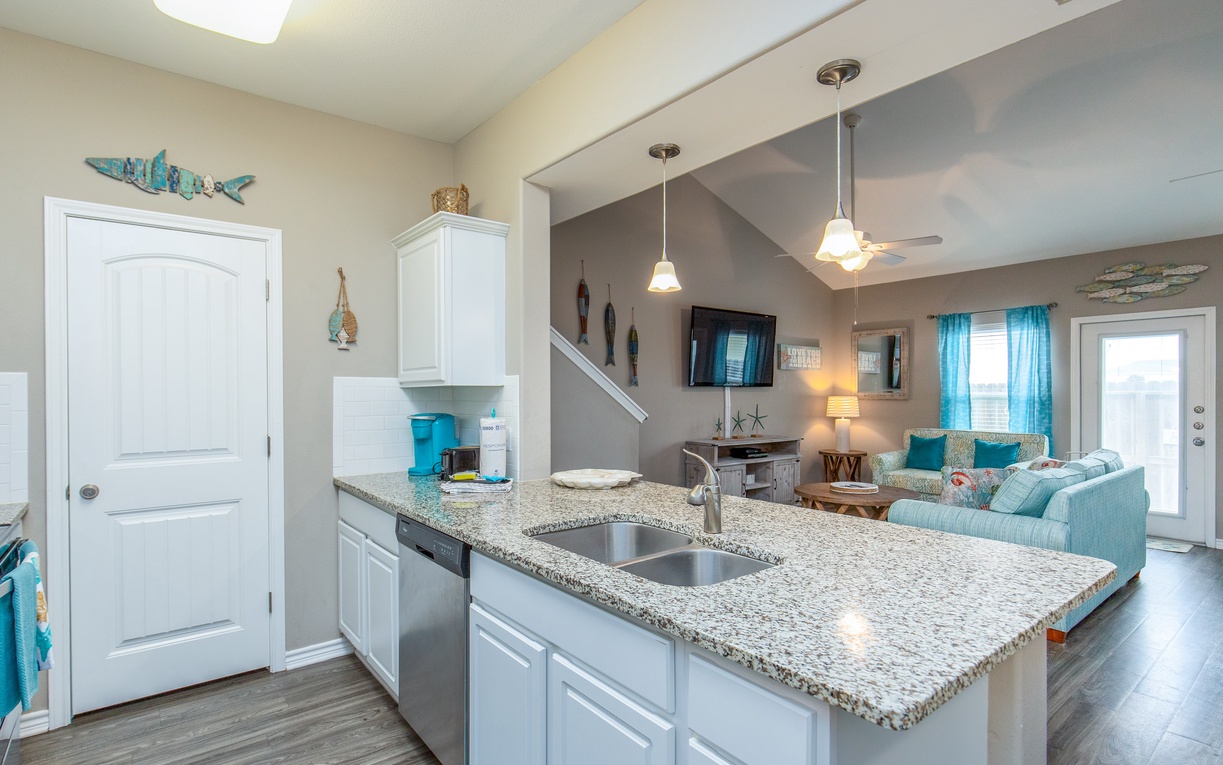 Your stylish kitchen island flows seamlessly into the welcoming living space, perfect for cooking while chatting with family.