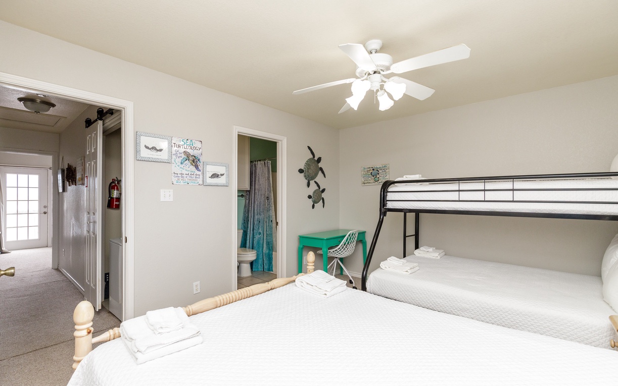 Your guest bedroom features a queen bed and twin over full bunk bed.