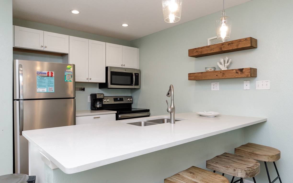 Your modern kitchen features stainless steel appliances, quartz countertops, and charming wood accents for memorable meal prep.