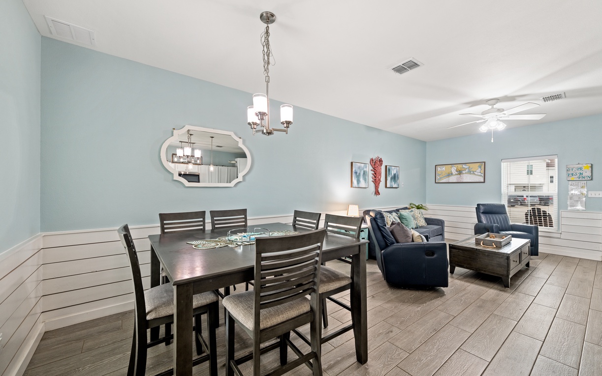 Settle in at your spacious dining table, perfect for meals and game nights, while relaxing in the cozy living area just steps away.