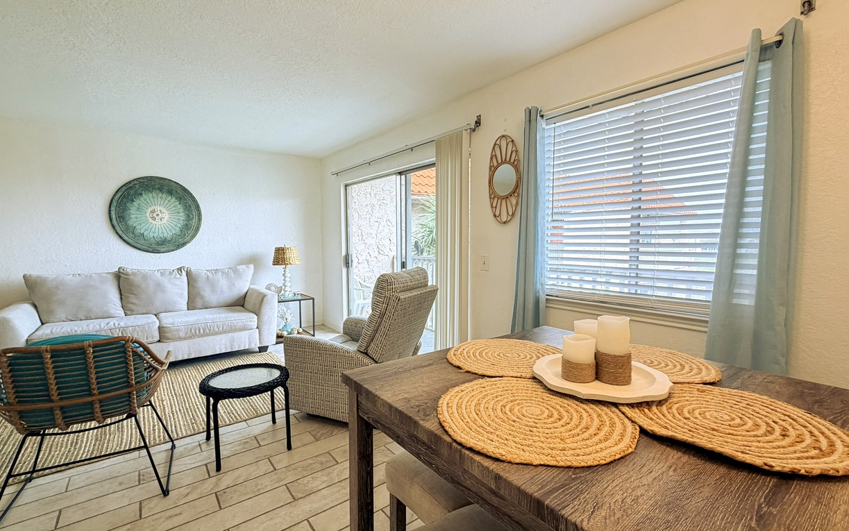 Your stylish living space combines coastal charm with modern comfort, featuring cozy seating and thoughtful touches throughout.