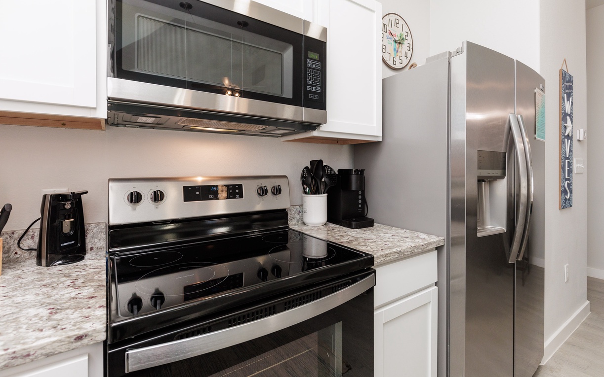 Your fully equipped kitchen features modern stainless steel appliances and granite countertops, perfect for preparing meals during your stay.