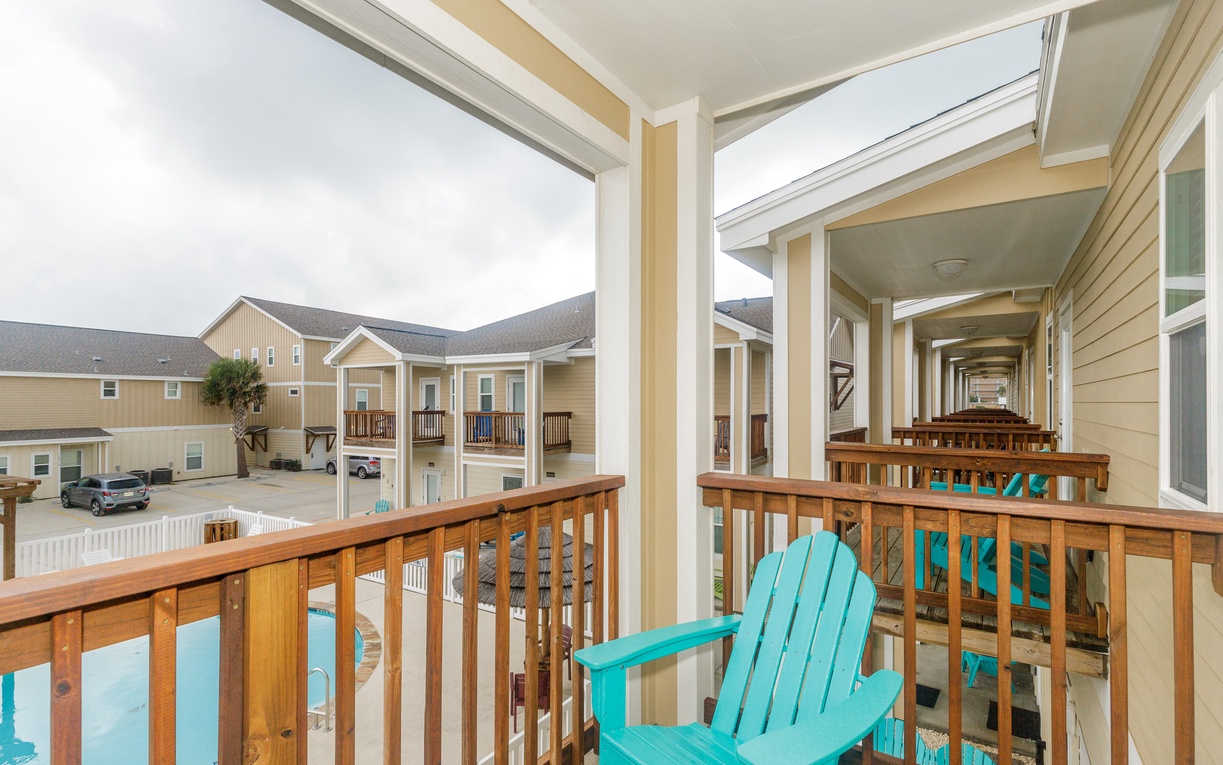 The primary bedroom also has a private balcony that overlooks the pool.