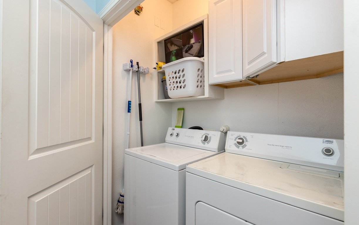 Your dedicated laundry space keeps your wardrobe fresh with full-size washer and dryer, plus convenient shelving for all your cleaning essentials.
