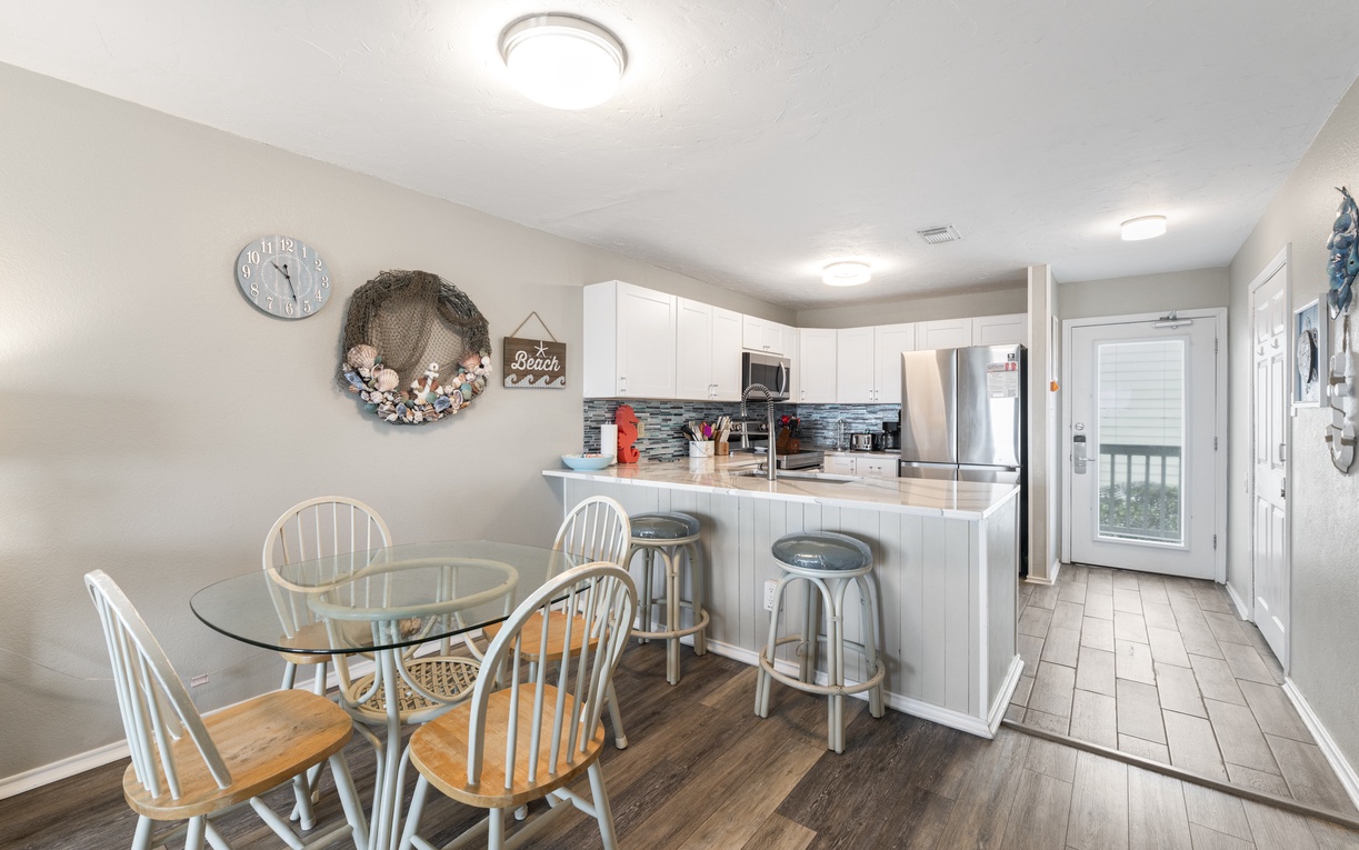 Your open-concept kitchen flows seamlessly into the dining area, creating the perfect space for morning coffee and evening meals together.