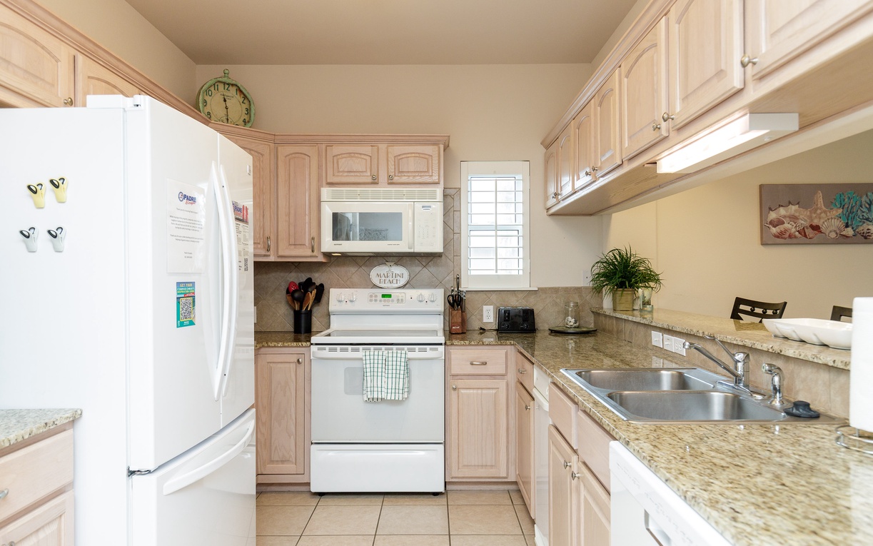 Your fully equipped kitchen awaits with granite countertops, stainless appliances, and everything needed to prepare your favorite meals.