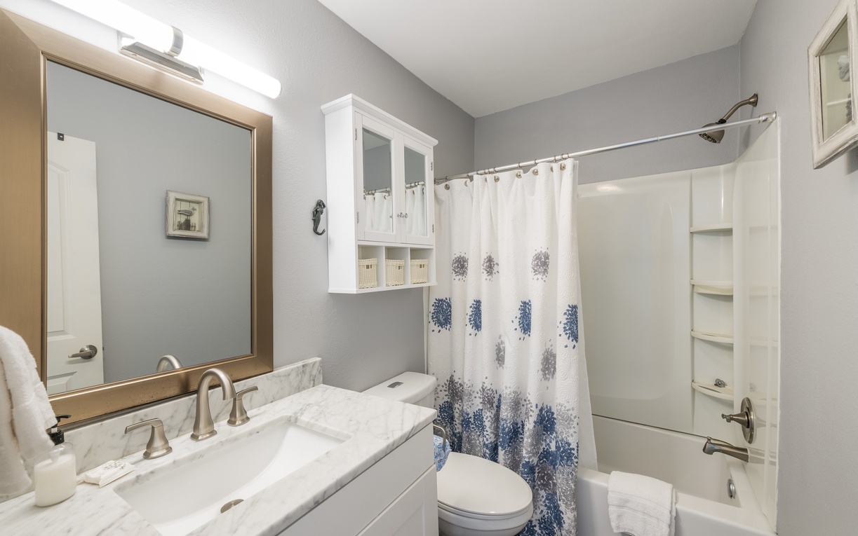 Refresh in your elegant bathroom with marble counters, spacious shower, and thoughtful details for a luxurious stay.