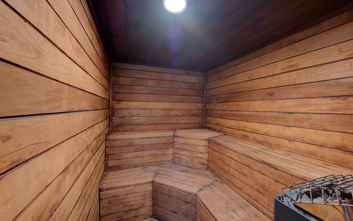 Unwind in your private sauna, where warm cedar surrounds you and soft lighting creates the perfect atmosphere for deep relaxation.