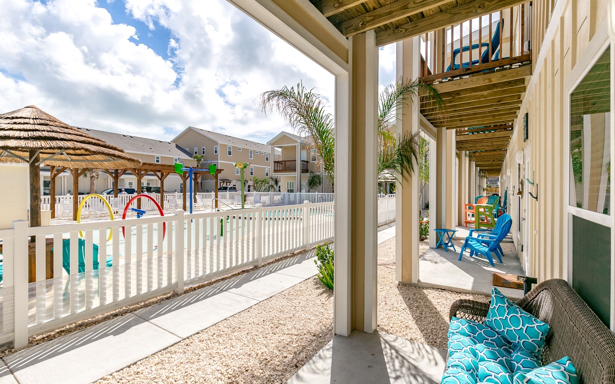Your private patio overlooks the colorful playground, where little ones can play safely while you relax in comfort.