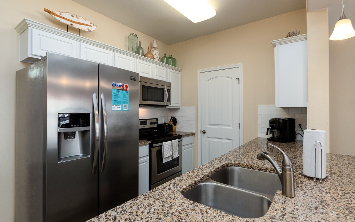 Your fully equipped kitchen invites culinary adventures with granite counters, stainless appliances, and everything you need for home-cooked meals.
