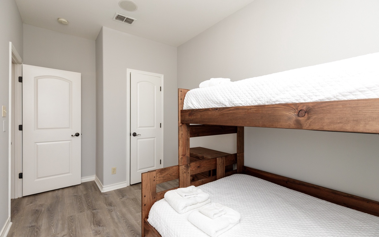 Your kids will love this cozy bunk bed room with a twin over full bunk and twin size trundle bed