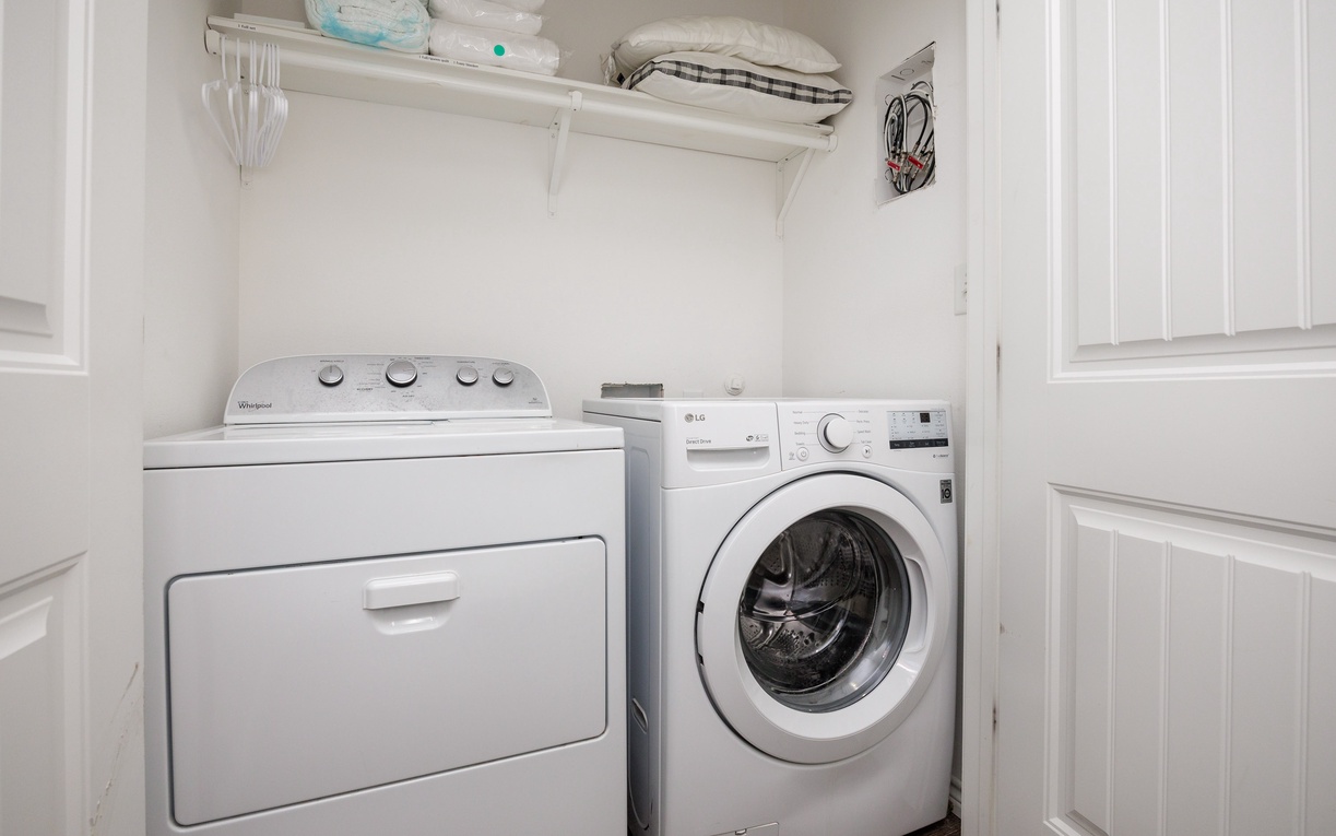 Your private laundry room keeps your clothes fresh with full-size washer and dryer, plus handy storage for linens and supplies.