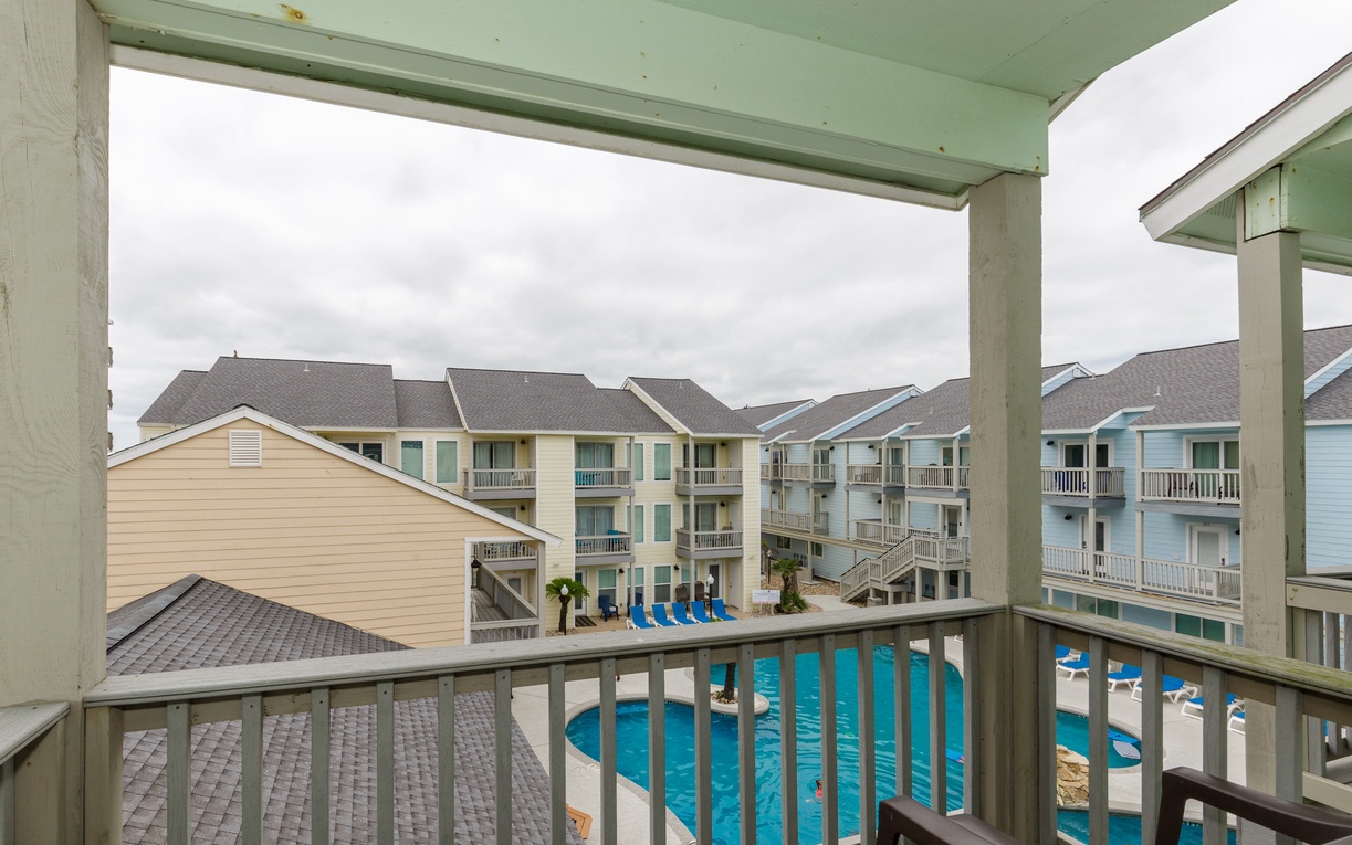 Your private balcony overlooks the sparkling pool where you can watch the day unfold in this peaceful coastal community.