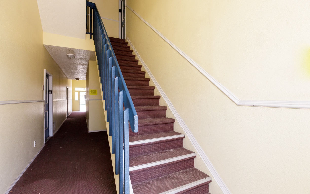 Navigate easily through your vacation rental with this well-maintained staircase, leading you comfortably to your home away from home.