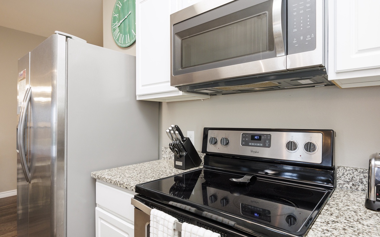 Your fully equipped kitchen awaits with granite countertops, stainless steel appliances, and everything you need to prepare delicious meals during your stay.