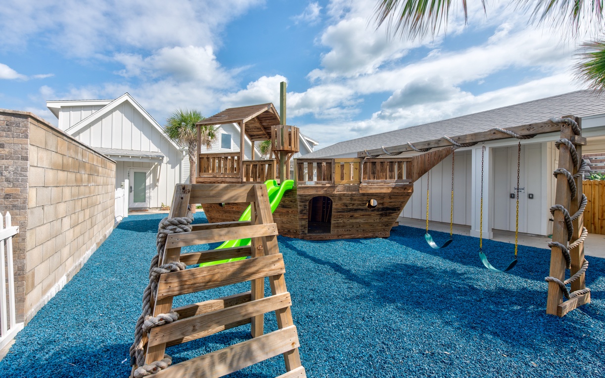 Adventure awaits in your private pirate ship playground! Kids will love exploring the fort, swings, and slides on soft blue surfacing.