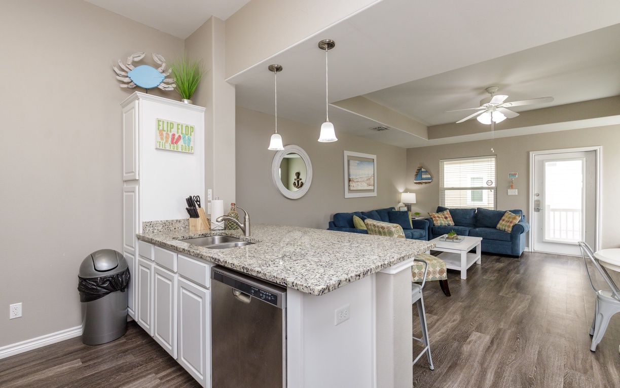 You'll love this open-concept space with granite countertops and coastal charm—perfect for cooking together and relaxing.