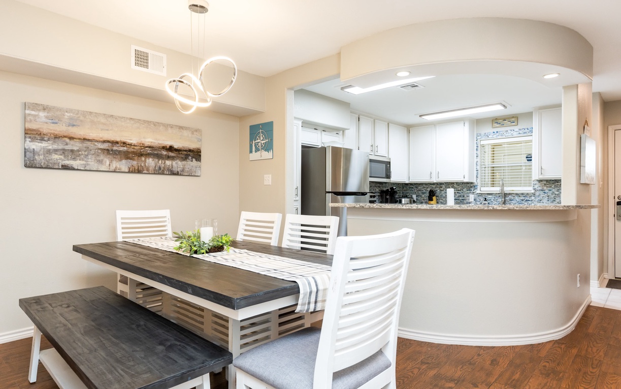 Your spacious dining area flows seamlessly into a modern kitchen, creating the perfect space for memorable meals together.
