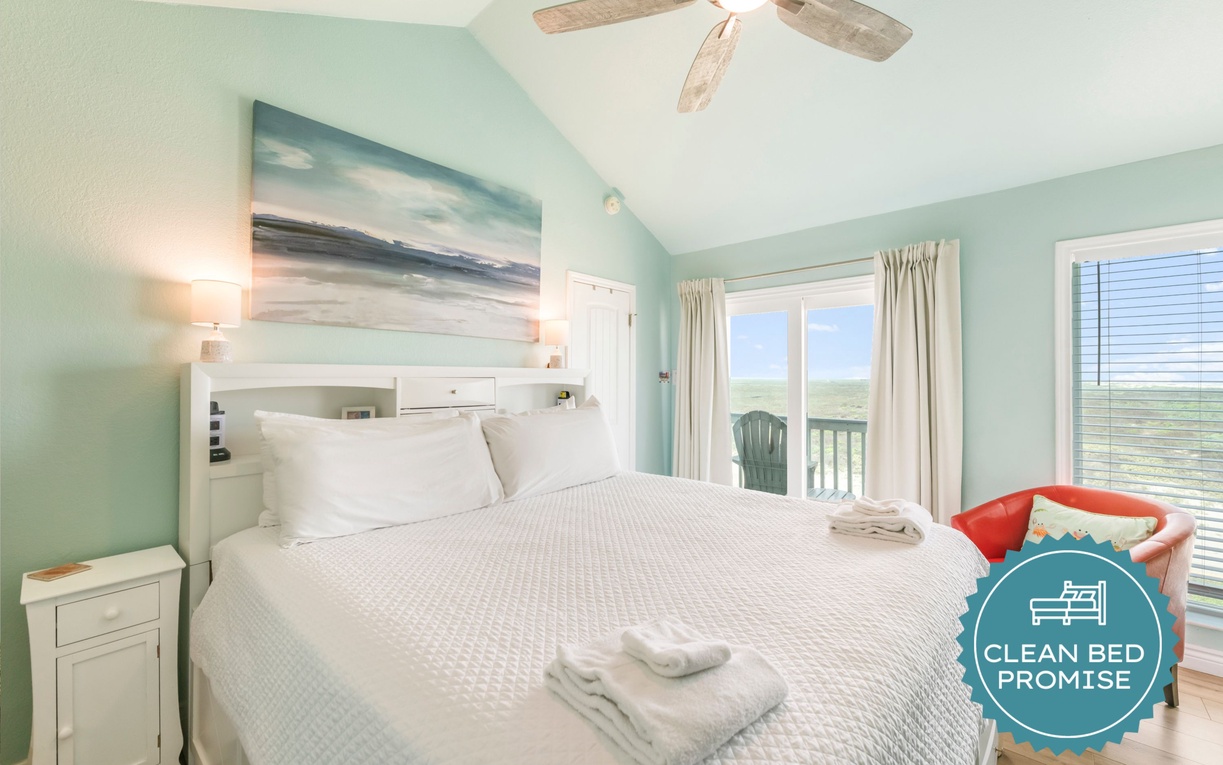 Relax in your tranquil bedroom with calming coastal tones, ocean-inspired art, and breezy balcony access. Fresh linens and ceiling fan ensure your comfort.