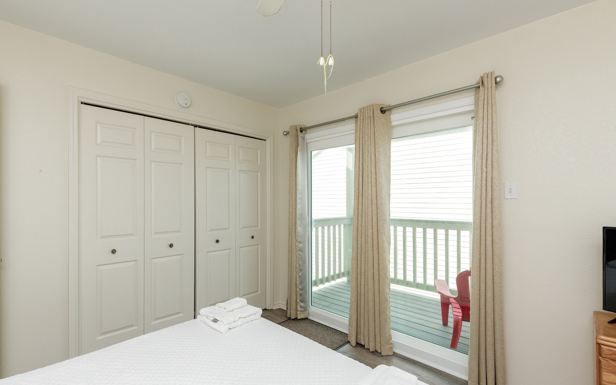 Guest bedroom on the second floor with a full bed and twin bed