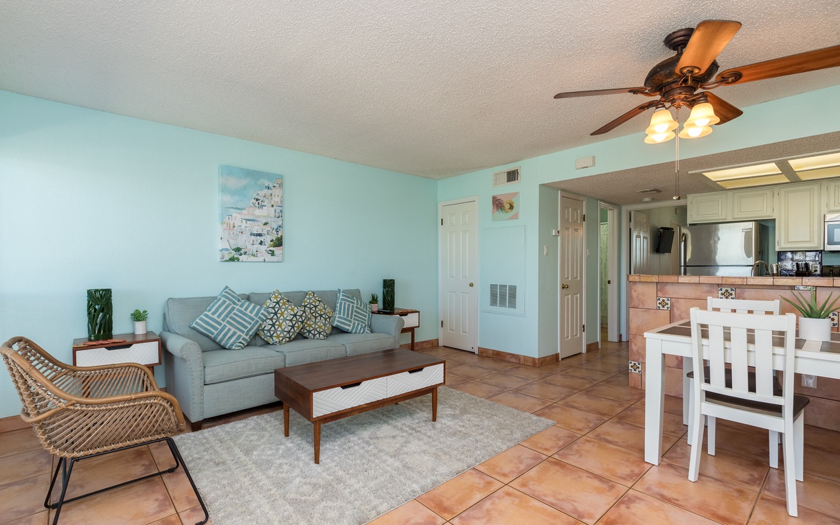 Relax in your bright, coastal-inspired living space with comfortable seating and open-concept design flowing into your fully equipped kitchen.
