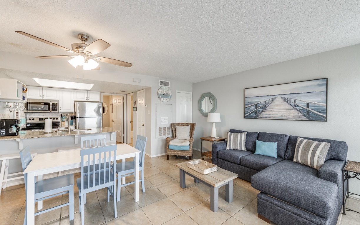 Relax in your coastal-inspired living space with comfortable seating, dining for four, and a fully-equipped kitchen—perfect for memorable vacation meals together.