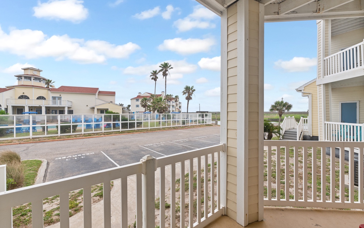Step onto your private balcony and soak in the coastal community views with palm trees swaying in the distance.
