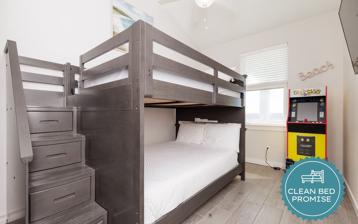 Your kids will love this fun bedroom with sturdy bunk beds and their own arcade game for hours of entertainment.