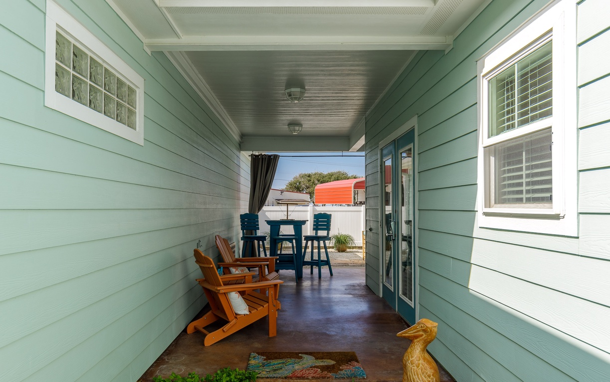 Relax in your private covered porch with comfortable seating, perfect for morning coffee or evening conversations.