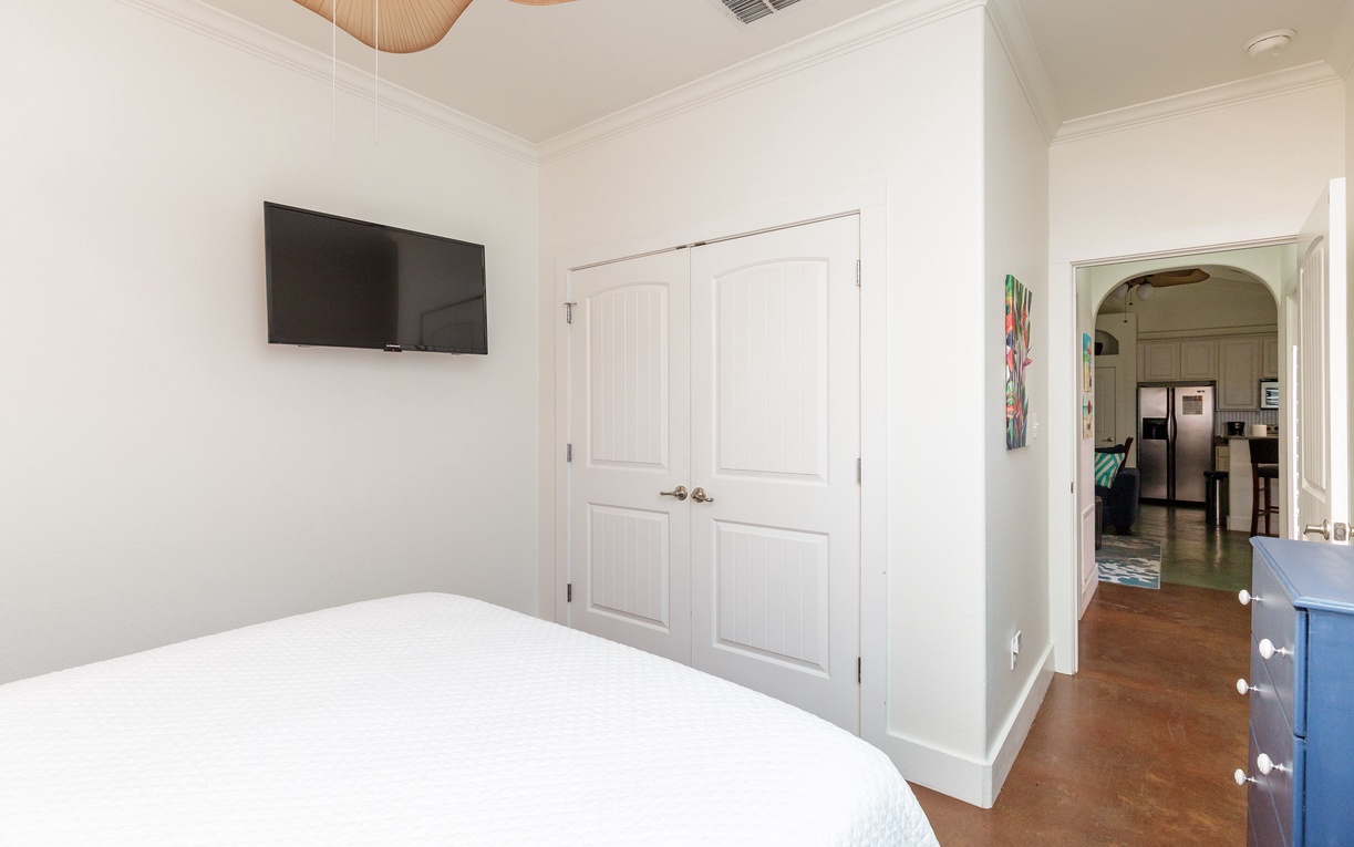 Drift into restful sleep in your queen size bed with crisp linens, modern TV, and thoughtful storage for all your belongings.