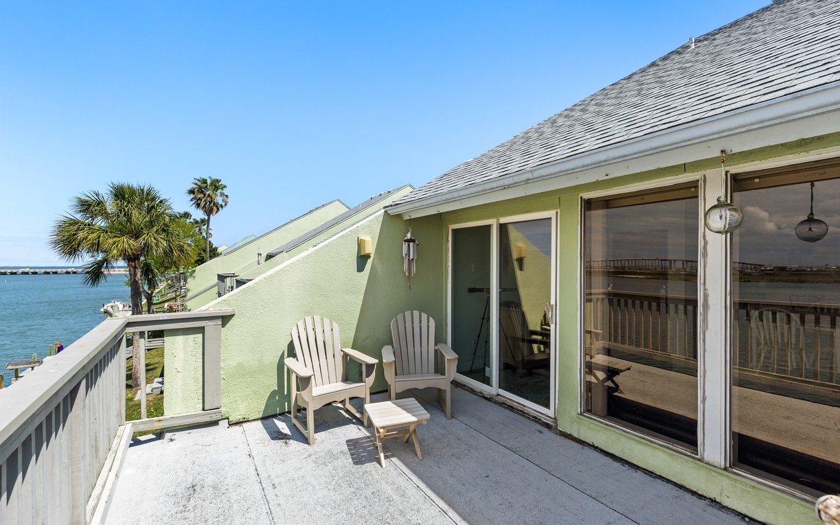 Step onto your private balcony where comfortable Adirondack chairs await you for peaceful moments overlooking tropical waters and swaying palms.