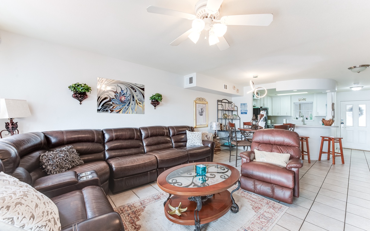 Sink into plush leather seating while coastal breezes flow through your open-concept haven, where comfort meets style.