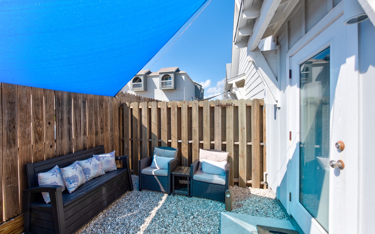 Relax in your private patio seating area with comfortable outdoor furniture and peaceful surroundings for morning coffee or evening unwinding.