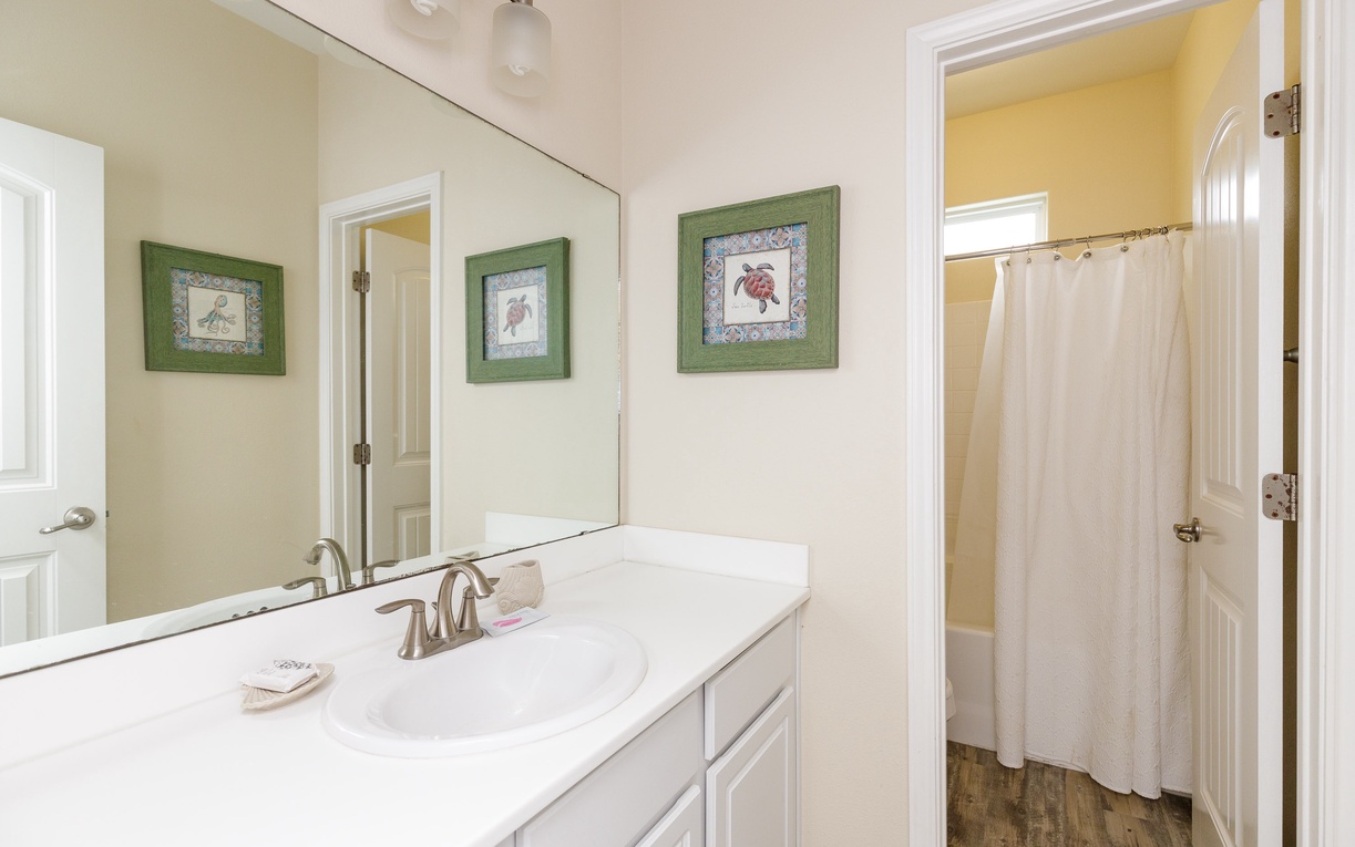 Your private bathroom features a spacious vanity with modern fixtures, perfect for your morning routine.