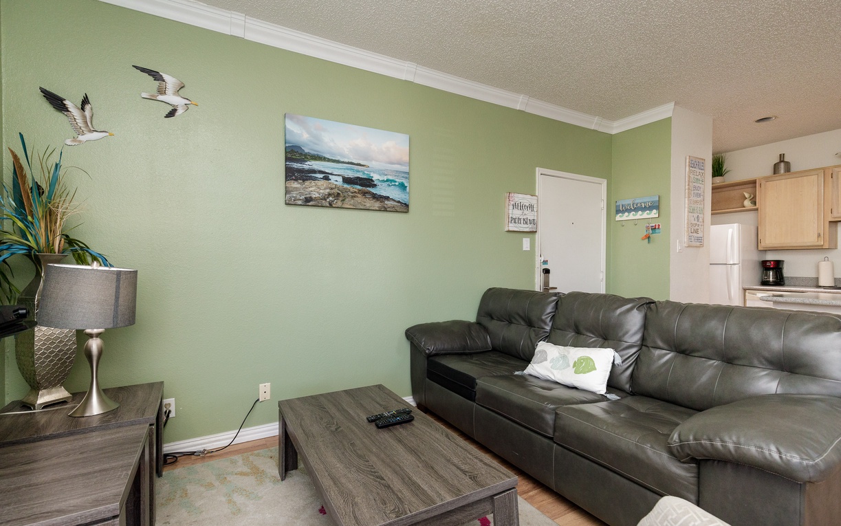 Relax on your spacious leather sectional while ocean breezes inspire coastal decor throughout your bright living space.
