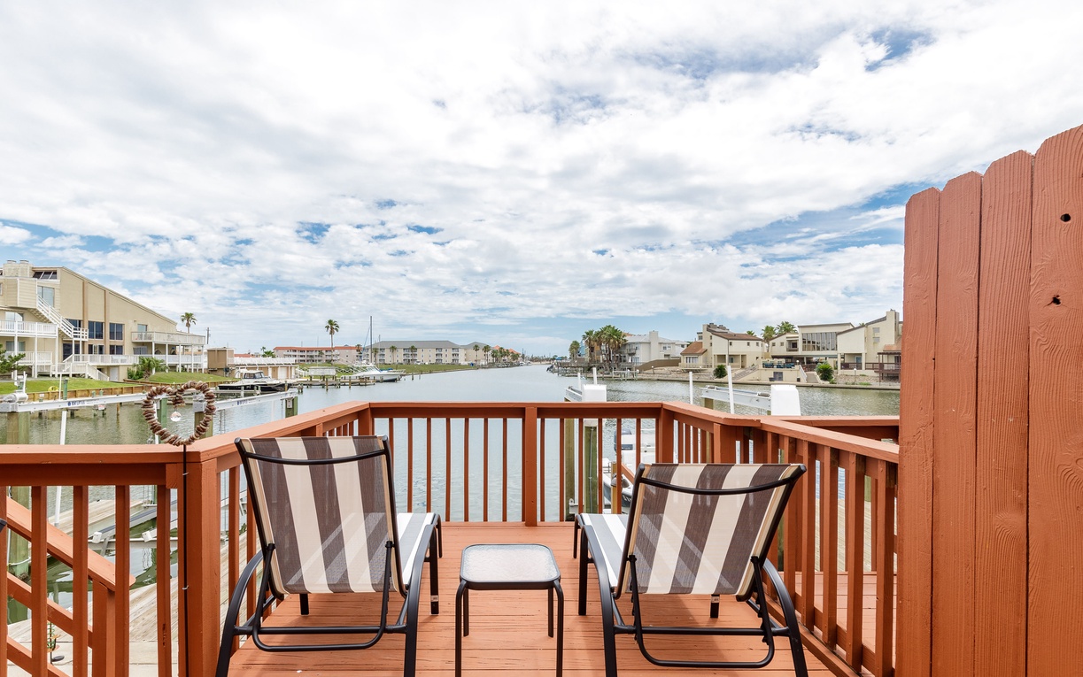 Relax in your waterfront sanctuary with canal views stretching toward the horizon from your private deck.