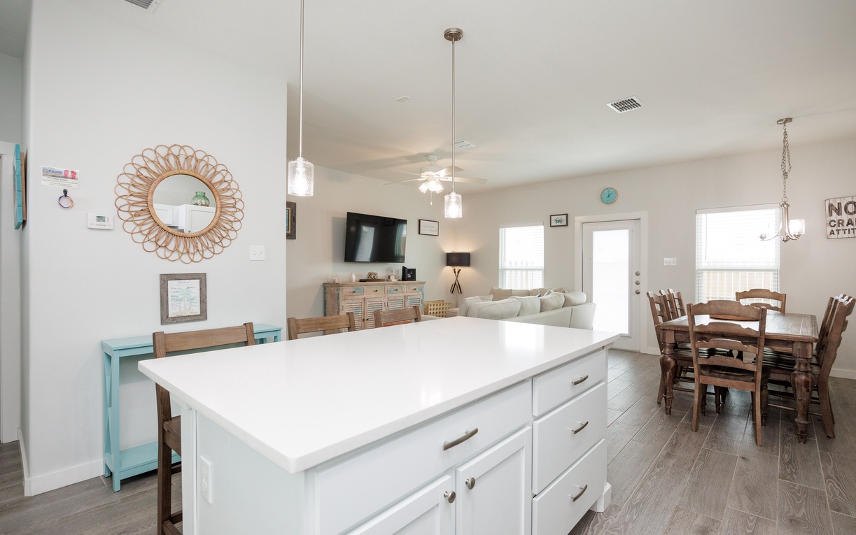 Your bright open-concept space flows seamlessly from kitchen to living and dining areas, perfect for gathering with loved ones.