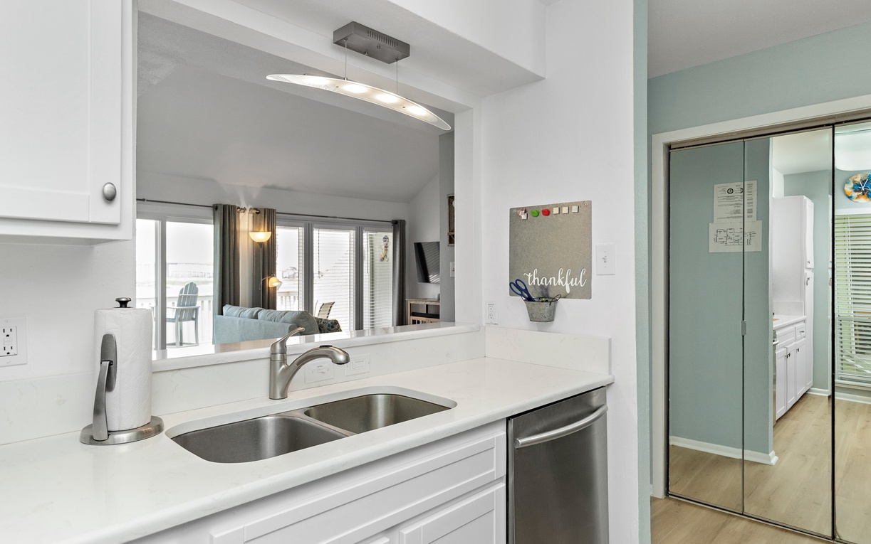 You'll love this modern kitchen with granite counters, stainless appliances, and open views to your bright living space.