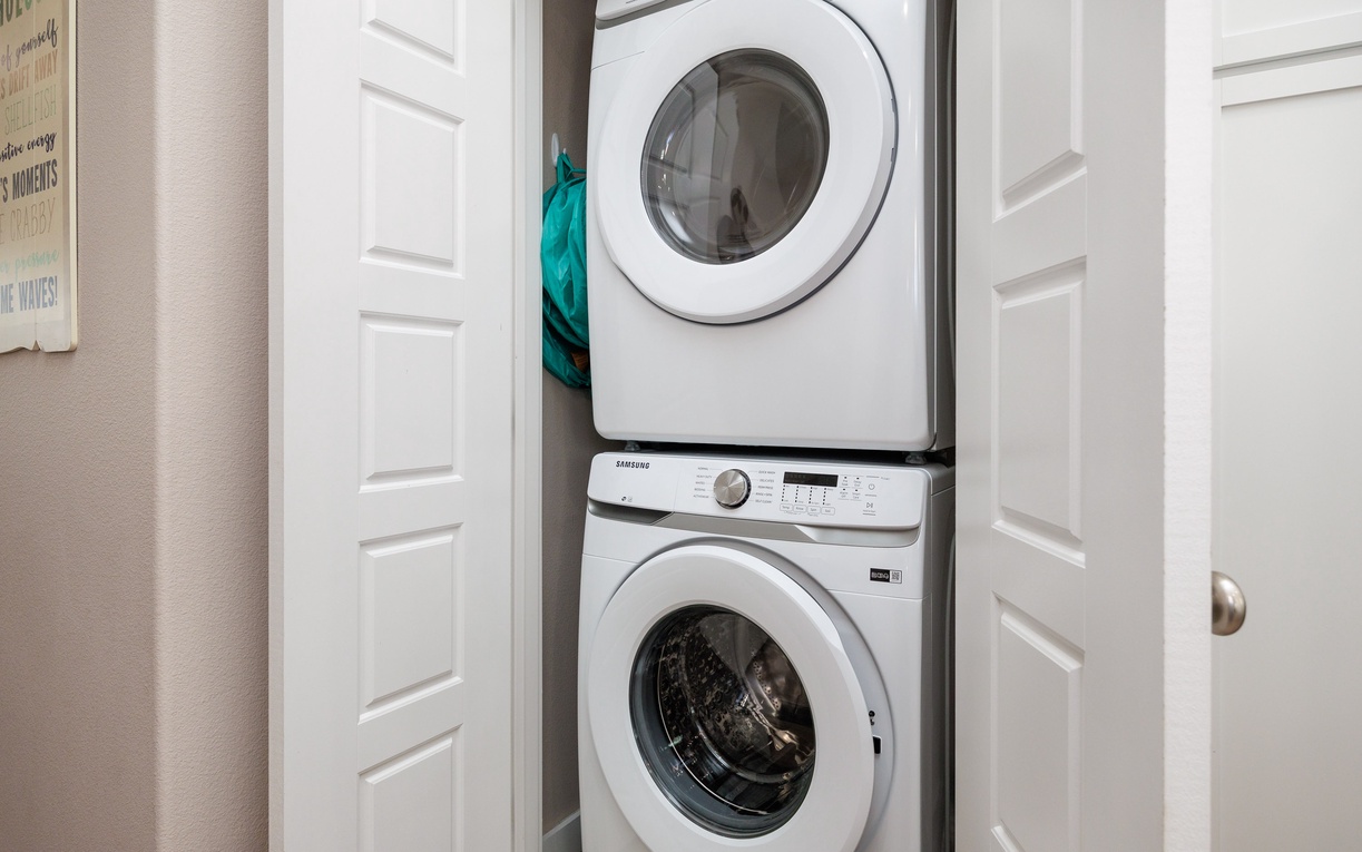 Your in-unit washer and dryer keep your clothes fresh throughout your stay, tucked neatly in this convenient closet space.