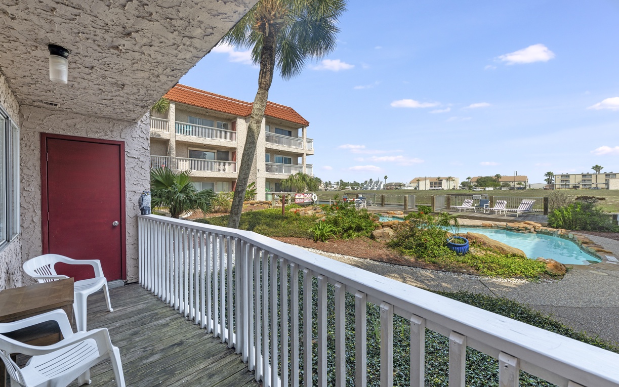 Step onto your private balcony and soak in tropical views of the sparkling pool and lush landscaping below.